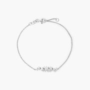 Graduated cluster moissanite chain bracelet in white gold